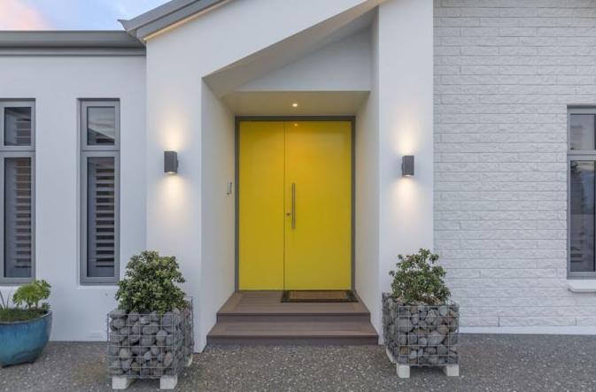 This yellow front door really makes a statement
